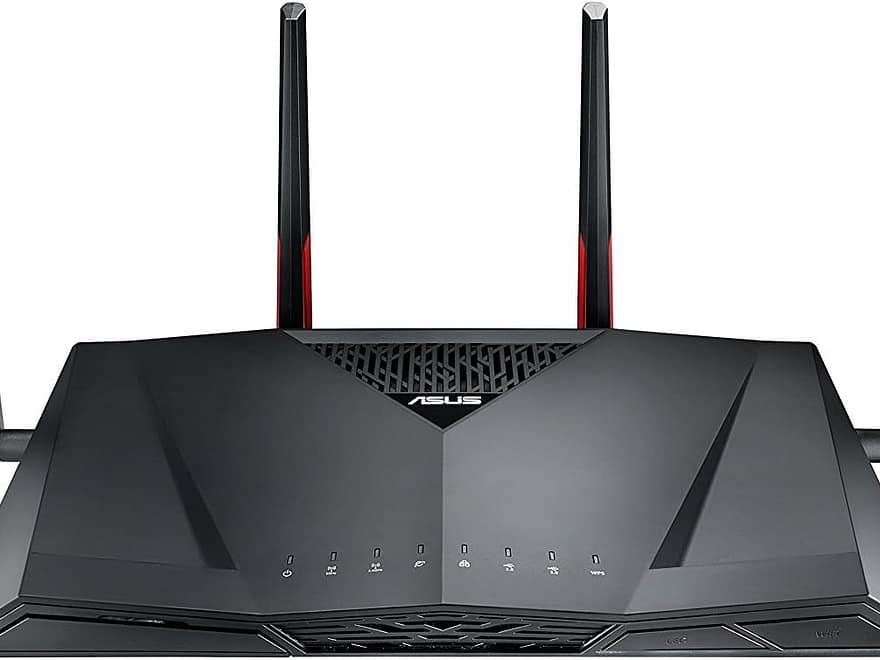 ASUS AC3100 Dual Band WiFi Gaming Router RT-AC88U, black angular router with four antennas and red accents