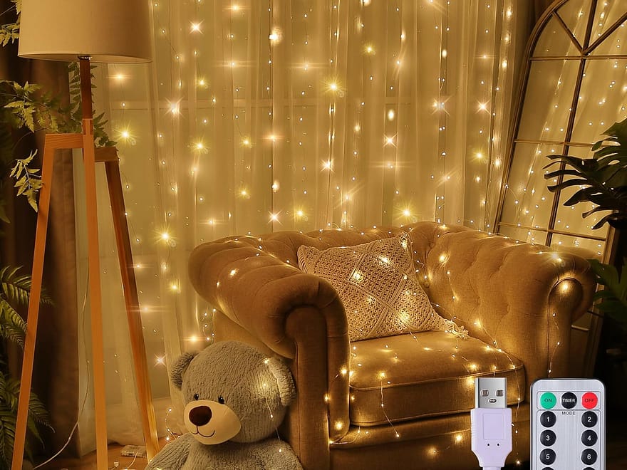 Meonum 195LED Curtain Tapestry String Lights with warm LEDs, USB controller, and remote in living room setting