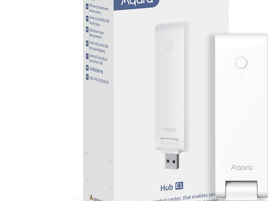Aqara Smart Hub E1 for home automation, white USB smart hub with button beside retail packaging