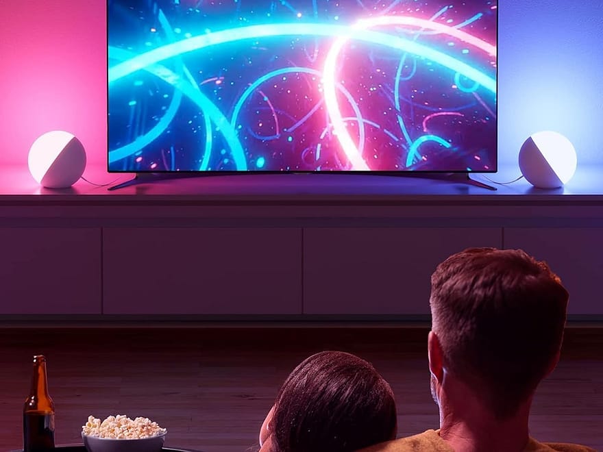 Hifree Touch Lamp multicolor night lights, round white lamps casting pink and blue ambient light beside a TV